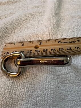 Coach keyring silver-toned carabiner strap fob featuring debossed logo detail